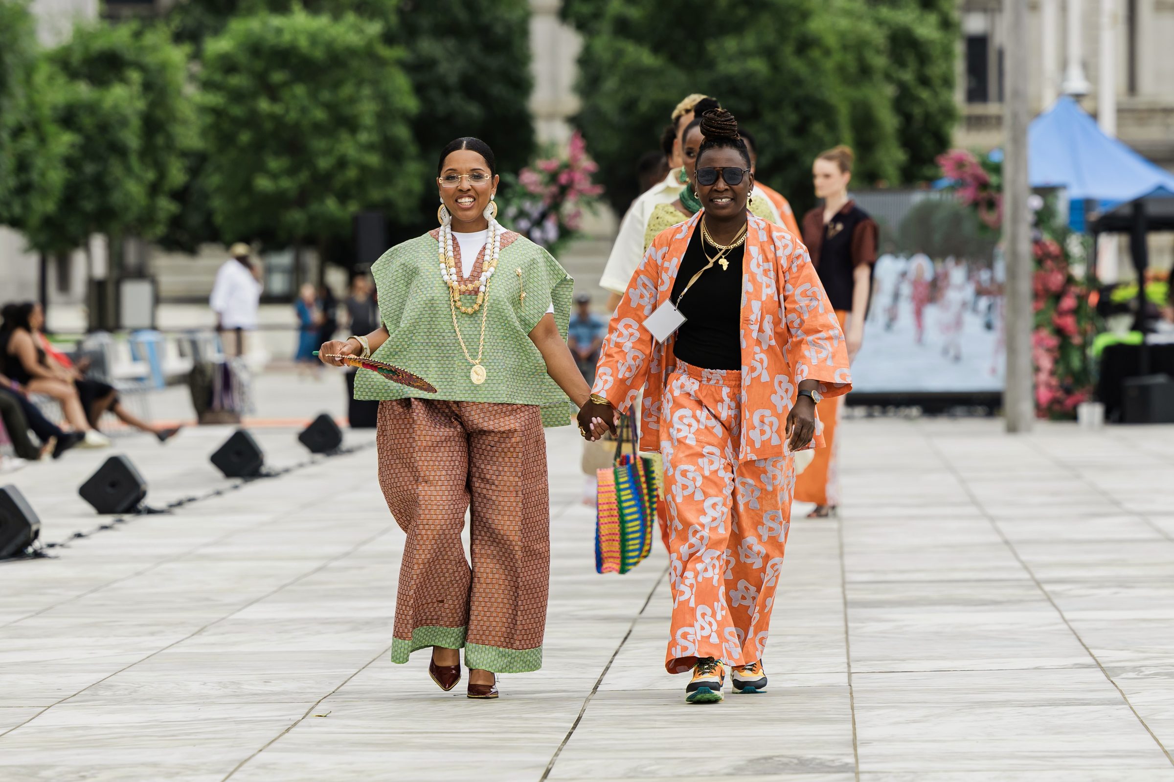 Mo Rabiu and the Mayor of Albany walking the MUSE runway hand in hand
